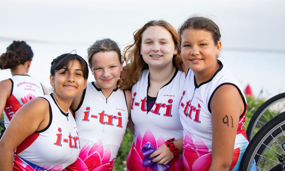 Group of 4 girls in i-tri race uniforms