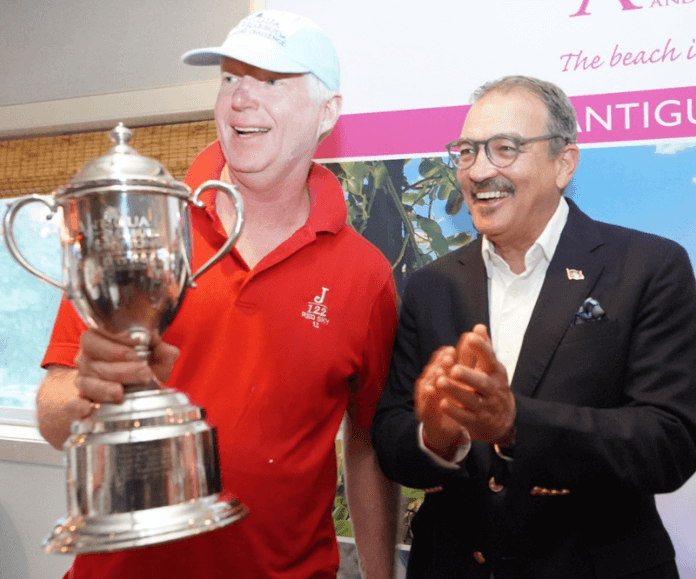 L-R John Pearson, Winner of the Antigua and Barbuda Hamptons Challenge Regatta with Antigua and Barbuda Tourism Minister, Hon. H. Charles Max Fernandez